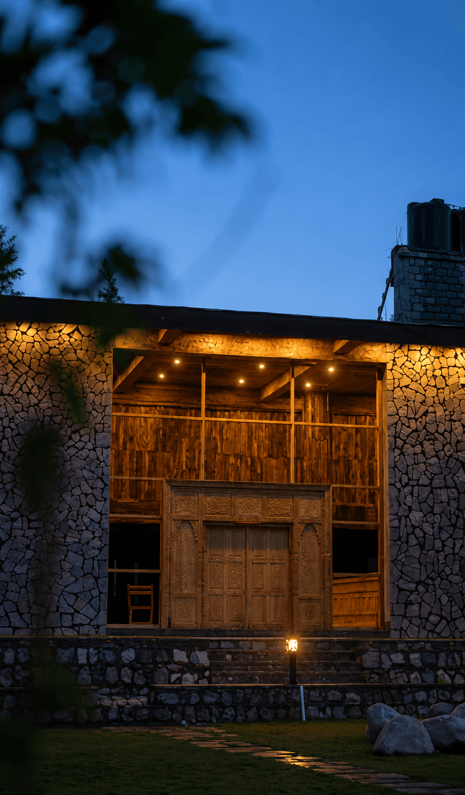 Warm wooden entrance architecture of Greystone Lodge Kalam